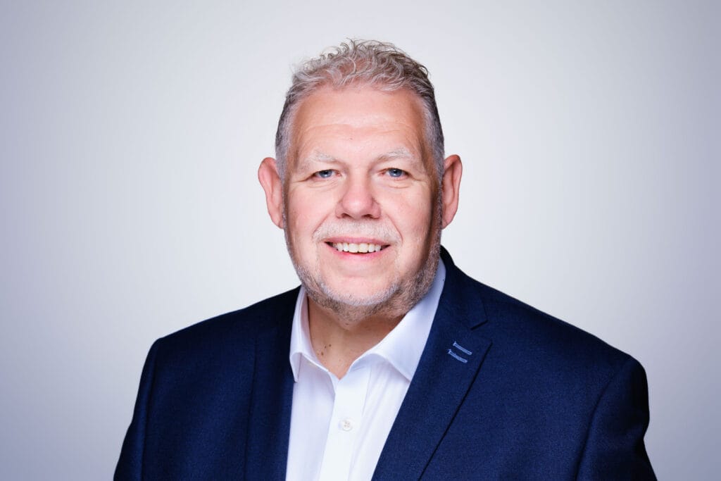 Professional headshot of Chris Smith, financial markets advisor.